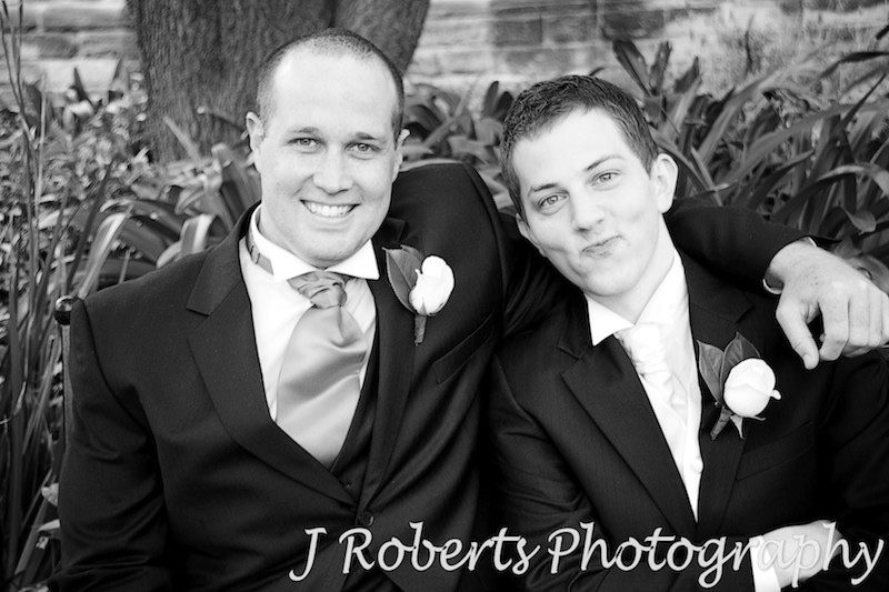 Groom pulling faces with groomsman - wedding photography sydney